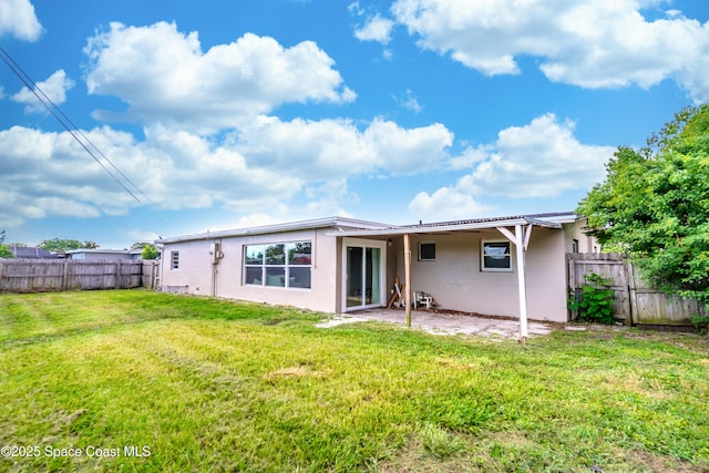 1768 Hudson Cir S, Melbourne, FL 32935 - rear view of property with stucco siding, a fenced backyard, and a patio