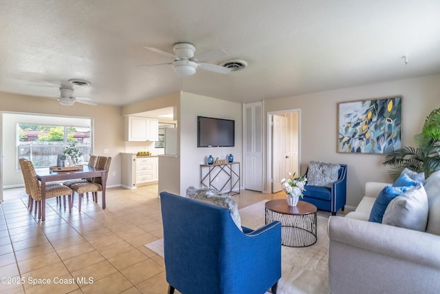1768 Hudson Cir S, Melbourne, FL 32935 - living room with a ceiling fan and light tile patterned floors