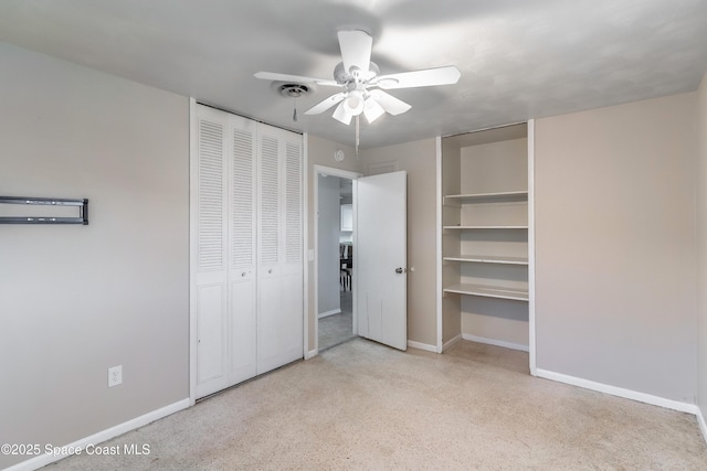 1768 Hudson Cir S, Melbourne, FL 32935 - unfurnished bedroom with multiple closets and a ceiling fan