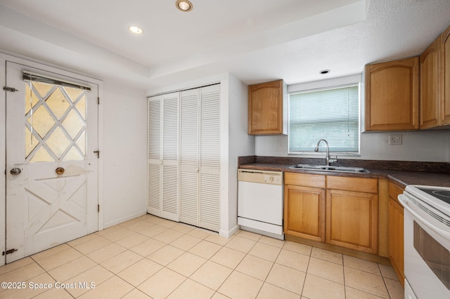 1727 Minutemen Cswy Unit 108, Cocoa Beach, FL 32931 - kitchen featuring white appliances, dark countertops, brown cabinetry, and recessed lighting