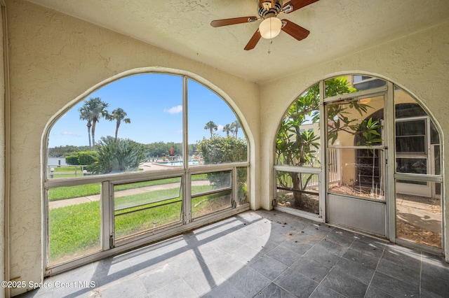 1727 Minutemen Cswy Unit 108, Cocoa Beach, FL 32931 - unfurnished sunroom with ceiling fan