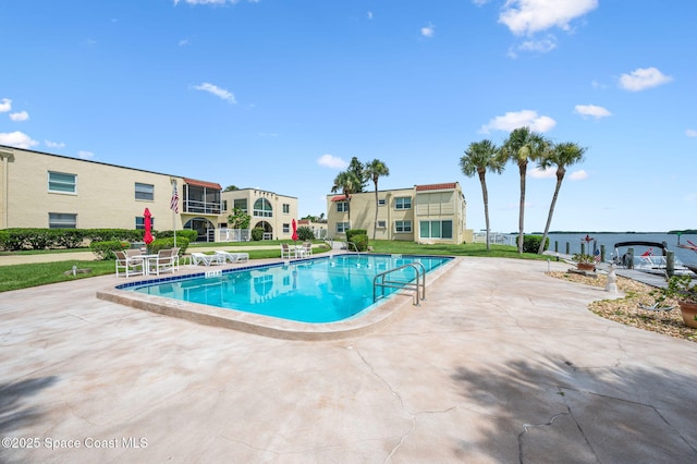 1727 Minutemen Cswy Unit 108, Cocoa Beach, FL 32931 - community pool featuring a patio and a lawn