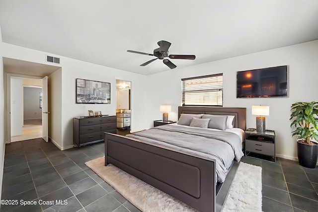 1727 Minutemen Cswy Unit 108, Cocoa Beach, FL 32931 - bedroom with dark tile patterned flooring, a ceiling fan, and connected bathroom