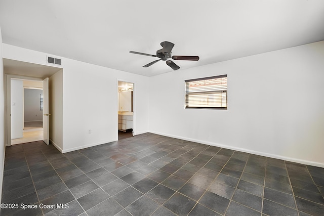 1727 Minutemen Cswy Unit 108, Cocoa Beach, FL 32931 - unfurnished bedroom with dark tile patterned floors and a ceiling fan