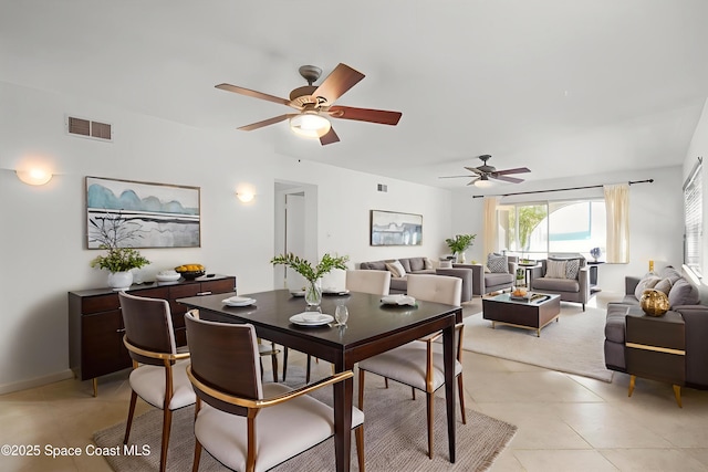 1727 Minutemen Cswy Unit 108, Cocoa Beach, FL 32931 - dining space featuring a ceiling fan
