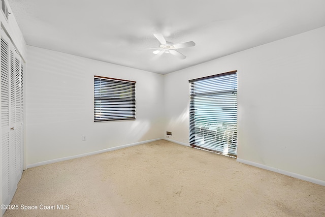 1727 Minutemen Cswy Unit 108, Cocoa Beach, FL 32931 - unfurnished bedroom featuring a closet, carpet floors, and a ceiling fan