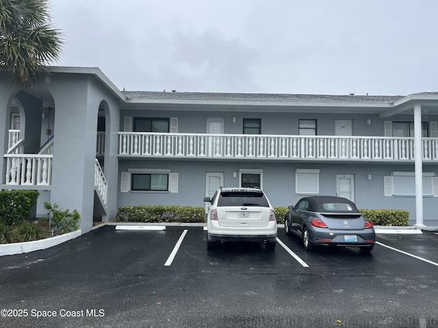 3799 S Banana River Blvd Unit 104, Cocoa Beach, FL 32931 - view of property with uncovered parking