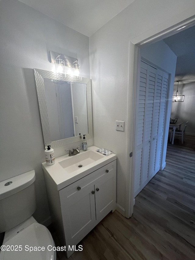 3799 S Banana River Blvd Unit 104, Cocoa Beach, FL 32931 - bathroom featuring vanity and wood finished floors