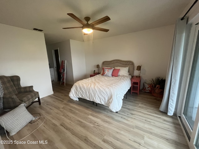 3799 S Banana River Blvd Unit 104, Cocoa Beach, FL 32931 - bedroom with wood finished floors and ceiling fan