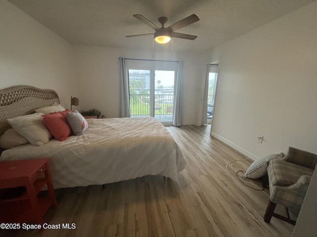 3799 S Banana River Blvd Unit 104, Cocoa Beach, FL 32931 - bedroom with light wood-type flooring, access to exterior, and a ceiling fan