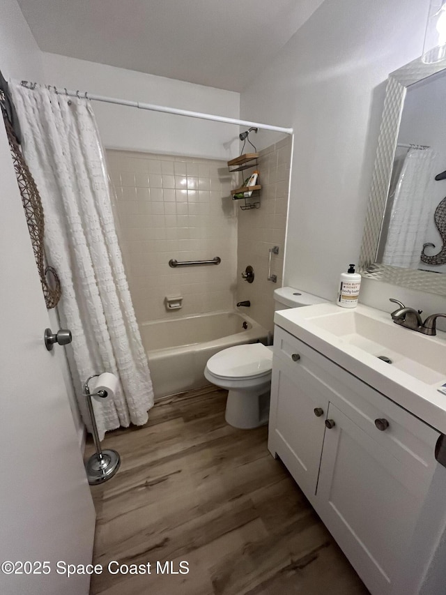 3799 S Banana River Blvd Unit 104, Cocoa Beach, FL 32931 - full bathroom with vanity, shower / tub combo with curtain, and wood finished floors