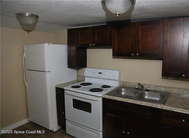 1038 W 10th St, Lakeland, FL 33805 - kitchen featuring white appliances, a textured ceiling, light countertops, and dark brown cabinetry
