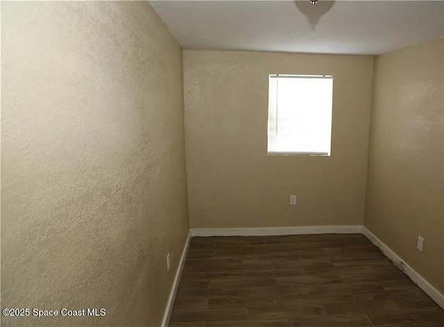 1038 W 10th St, Lakeland, FL 33805 - spare room with wood finished floors and a textured wall
