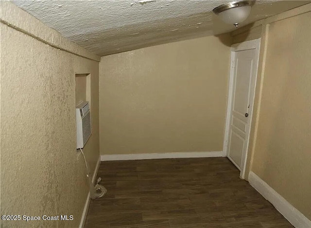 1038 W 10th St, Lakeland, FL 33805 - hall with wood finished floors, a textured wall, and a textured ceiling