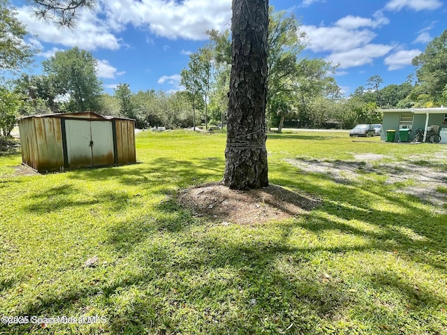316 Bay Ave, Cocoa, FL 32922 - view of grassy yard with a storage shed