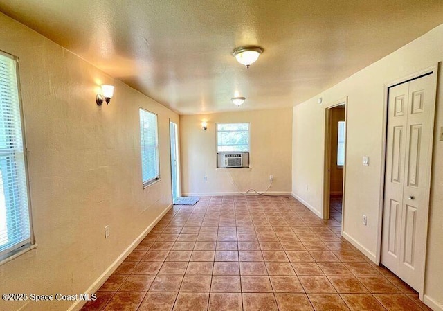 316 Bay Ave, Cocoa, FL 32922 - tiled empty room with baseboards and cooling unit