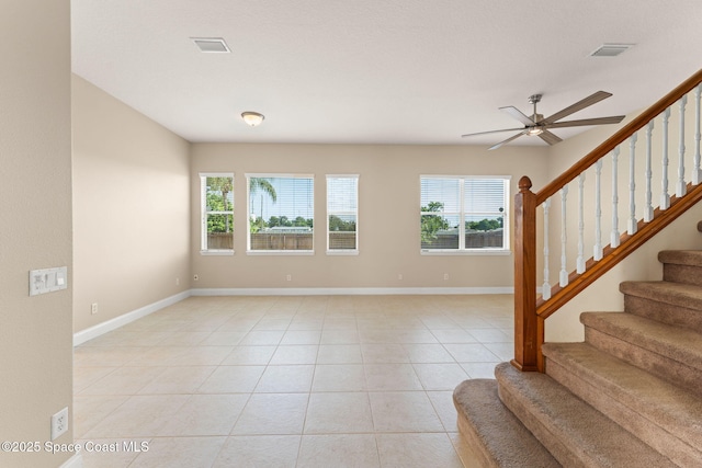 2032 Elkins Pt, Melbourne, FL 32935 - foyer entrance with ceiling fan, stairs, and light tile patterned flooring