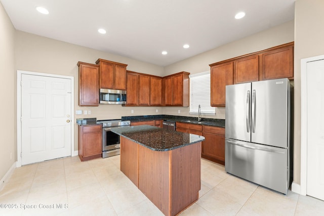 2032 Elkins Pt, Melbourne, FL 32935 - kitchen featuring appliances with stainless steel finishes, a kitchen island, brown cabinets, recessed lighting, and dark stone counters
