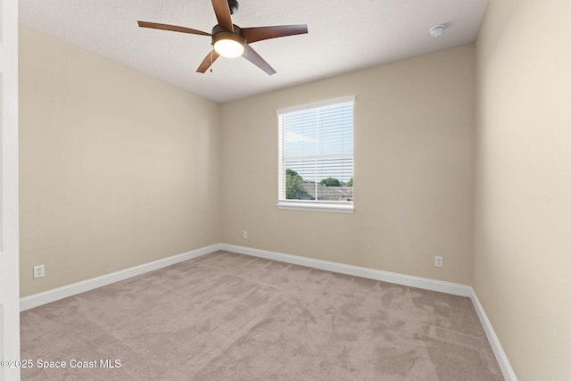 2032 Elkins Pt, Melbourne, FL 32935 - carpeted empty room with a ceiling fan and a smoke detector