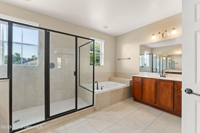 2032 Elkins Pt, Melbourne, FL 32935 - bathroom with vanity, a garden tub, tile patterned flooring, and a shower stall