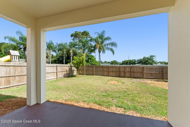 2032 Elkins Pt, Melbourne, FL 32935 - fenced backyard with a patio area