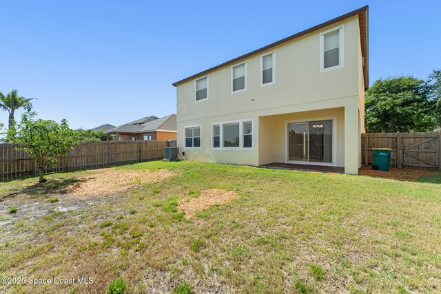 2032 Elkins Pt, Melbourne, FL 32935 - back of house featuring stucco siding and a fenced backyard