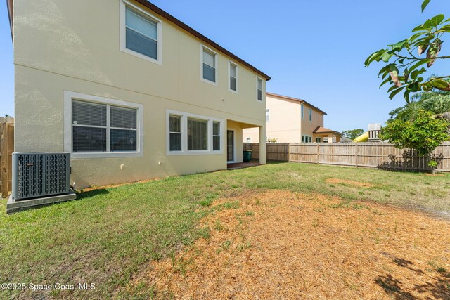 2032 Elkins Pt, Melbourne, FL 32935 - back of property with stucco siding and a fenced backyard