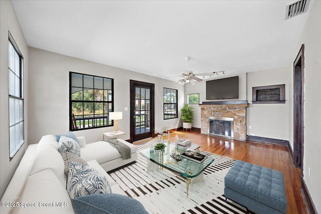 415 2nd Ave, Indialantic, FL 32903 - living area with a fireplace, wood finished floors, and ceiling fan
