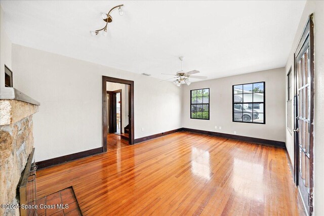 415 2nd Ave, Indialantic, FL 32903 - unfurnished living room featuring light wood-style floors and ceiling fan