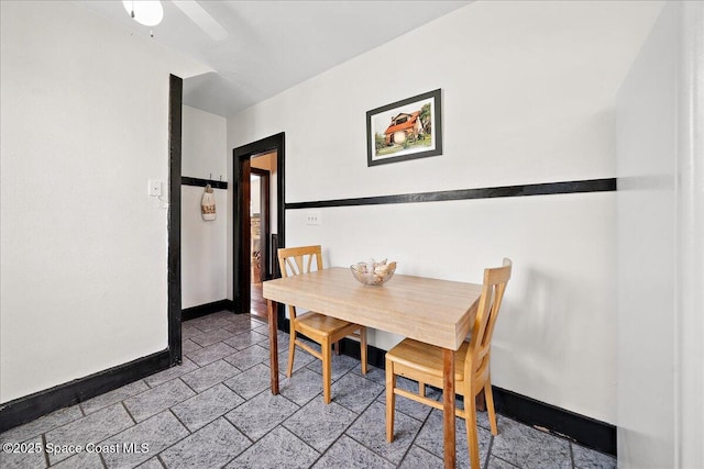 415 2nd Ave, Indialantic, FL 32903 - dining room with stone tile floors and a ceiling fan