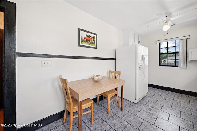 415 2nd Ave, Indialantic, FL 32903 - dining space featuring baseboards and ceiling fan