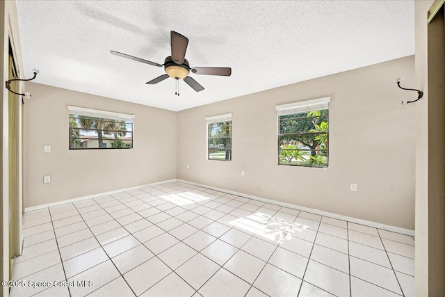 415 2nd Ave, Indialantic, FL 32903 - unfurnished room featuring a ceiling fan, a textured ceiling, and light tile patterned floors