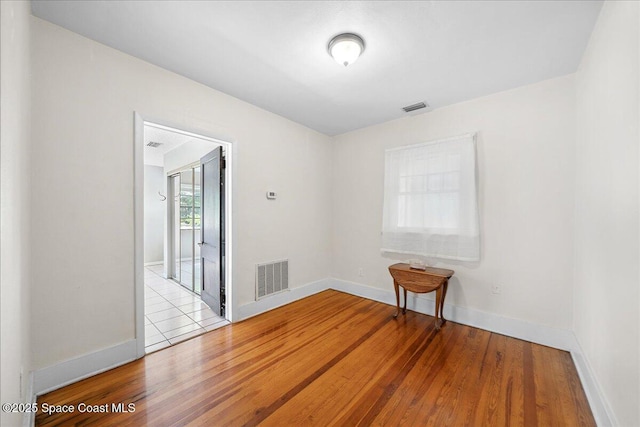 415 2nd Ave, Indialantic, FL 32903 - spare room with wood finished floors and baseboards