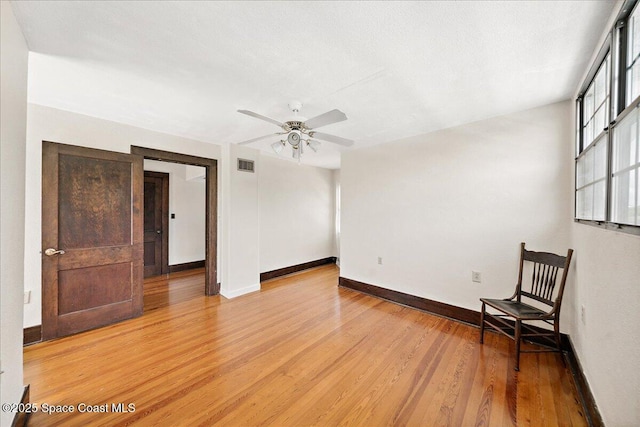 415 2nd Ave, Indialantic, FL 32903 - empty room with light wood-style flooring and ceiling fan