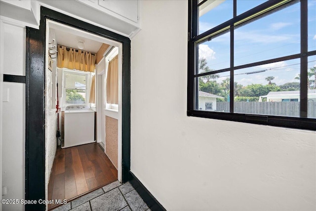 415 2nd Ave, Indialantic, FL 32903 - hall featuring washer / dryer and healthy amount of natural light