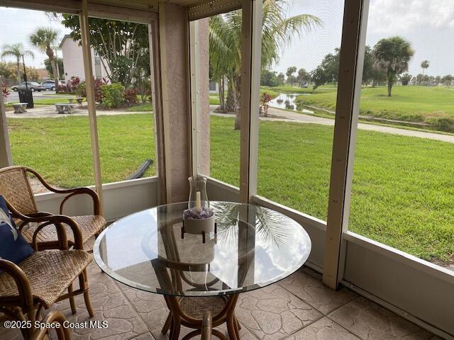 2727 N Wickham Rd # 106-7, Melbourne, FL 32935 - sunroom with a water view