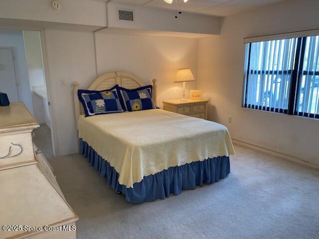 2727 N Wickham Rd # 106-7, Melbourne, FL 32935 - bedroom with light carpet