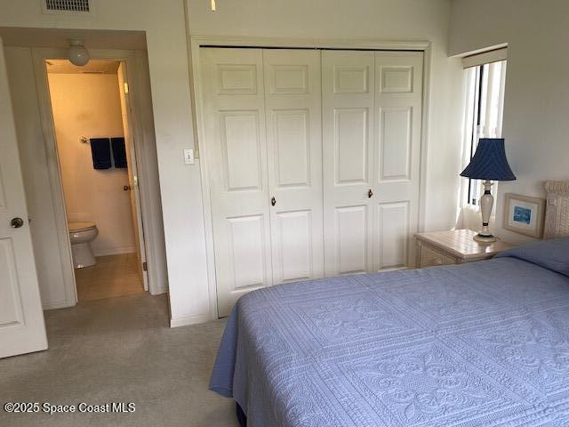 2727 N Wickham Rd # 106-7, Melbourne, FL 32935 - bedroom featuring a closet and carpet