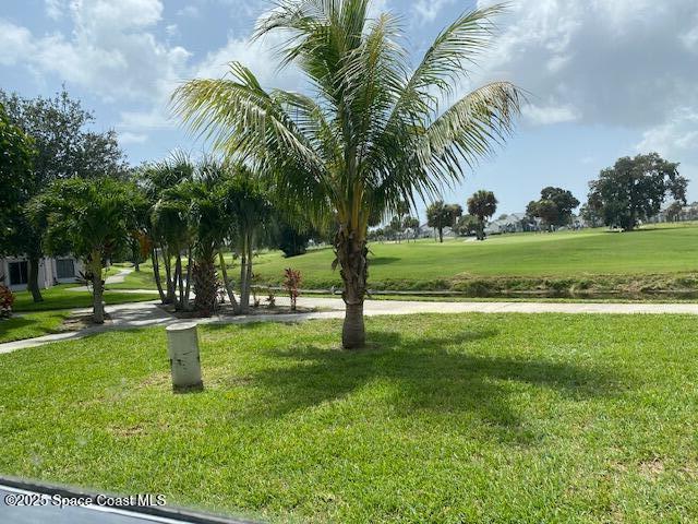 2727 N Wickham Rd # 106-7, Melbourne, FL 32935 - surrounding community featuring a yard
