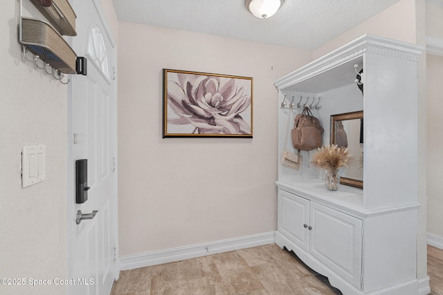 1036 Greenleaf Ct, Rockledge, FL 32955 - mudroom featuring baseboards