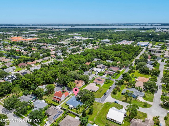 1036 Greenleaf Ct, Rockledge, FL 32955 - aerial view of property's location featuring nearby suburban area and a large body of water