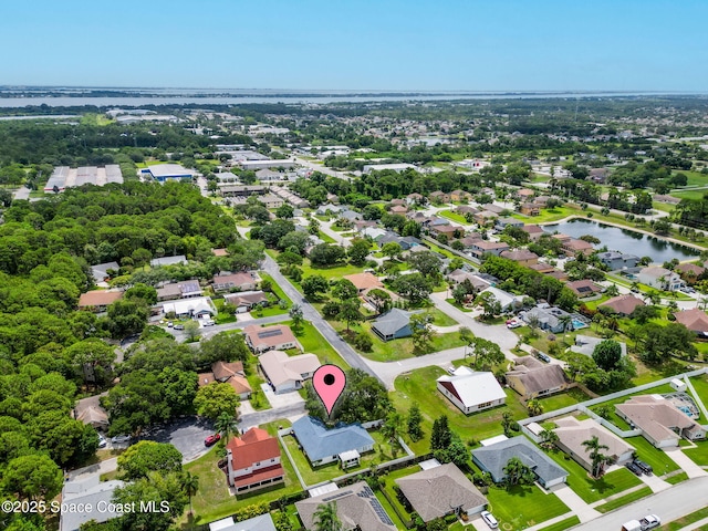 1036 Greenleaf Ct, Rockledge, FL 32955 - aerial overview of property's location featuring a large body of water and nearby suburban area
