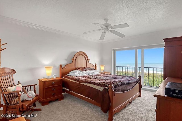 3170 N Atlantic Ave N Unit 403, Cocoa Beach, FL 32931 - bedroom featuring light carpet, access to exterior, ornamental molding, a textured ceiling, and ceiling fan