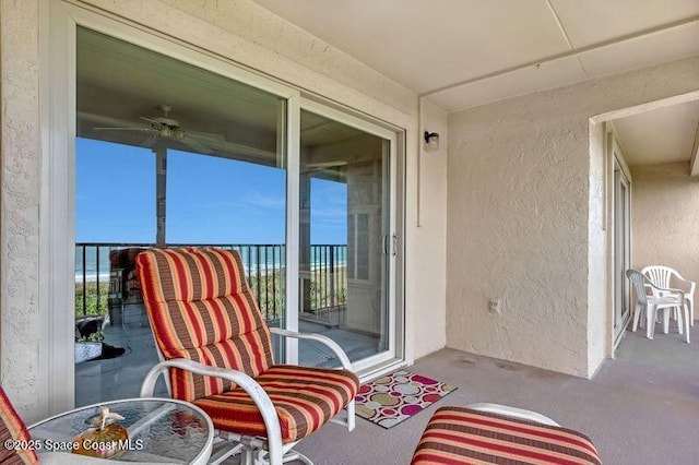3170 N Atlantic Ave N Unit 403, Cocoa Beach, FL 32931 - sunroom / solarium with plenty of natural light and a ceiling fan