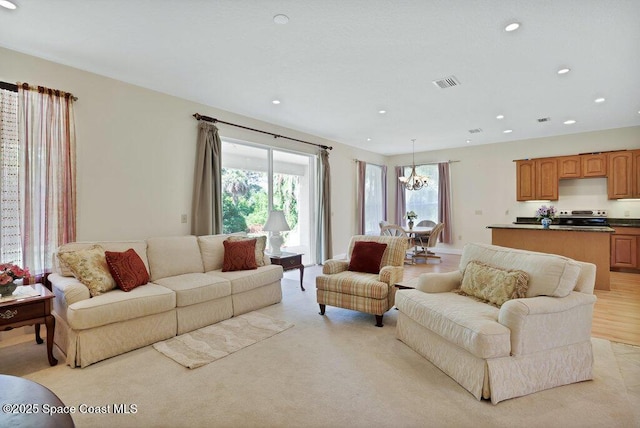 3825 Allen Ave, Micco, FL 32976 - living room featuring a chandelier and recessed lighting
