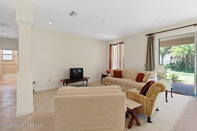 3825 Allen Ave, Micco, FL 32976 - living room with healthy amount of natural light, ornate columns, and recessed lighting