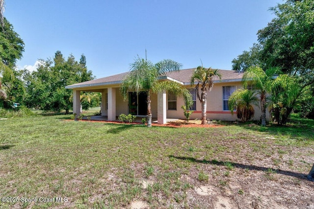3825 Allen Ave, Micco, FL 32976 - view of front facade featuring stucco siding and a front lawn