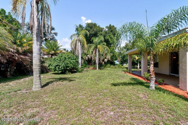 3825 Allen Ave, Micco, FL 32976 - view of green lawn with a patio