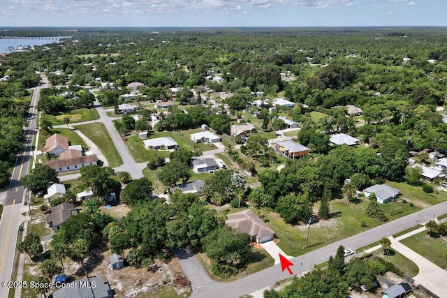 3825 Allen Ave, Micco, FL 32976 - aerial view of property and surrounding area with a heavily wooded area and nearby suburban area