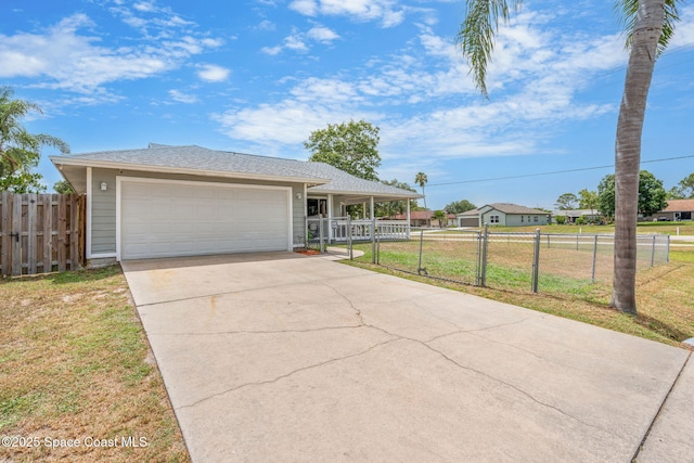 1298 Corning Ave NW, Palm Bay, FL 32907 - view of front of property with driveway and an attached garage